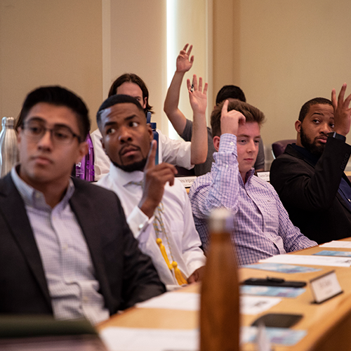 students voting during a TCU SGA House of Representatives meeting